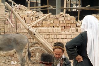 44 Kashgar Sunday Market 1993 Man Repairing Shoes